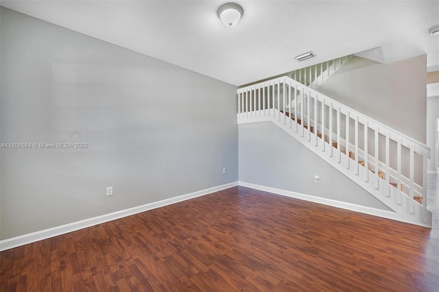 1985 SE 3rd St, Homestead, FL 33033 - unfurnished living room with wood finished floors, baseboards, and stairway