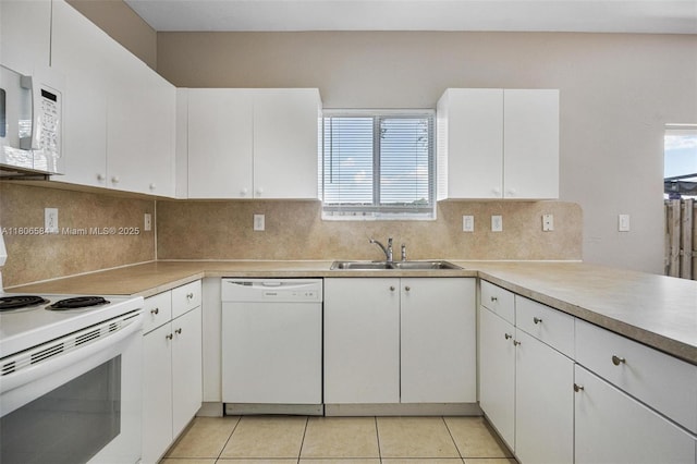 1985 SE 3rd St, Homestead, FL 33033 - kitchen featuring white appliances, a sink, white cabinetry, and light tile patterned floors