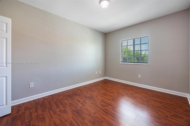 1985 SE 3rd St, Homestead, FL 33033 - empty room featuring wood finished floors and baseboards