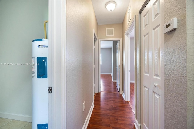 1985 SE 3rd St, Homestead, FL 33033 - hall featuring a textured wall, baseboards, and wood finished floors