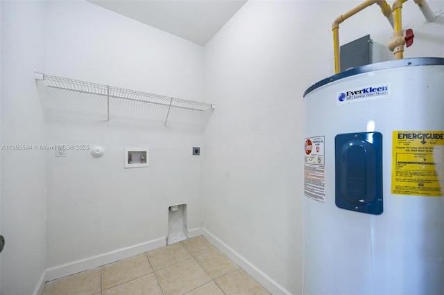 1985 SE 3rd St, Homestead, FL 33033 - washroom featuring electric water heater, hookup for a washing machine, light tile patterned flooring, electric dryer hookup, and baseboards