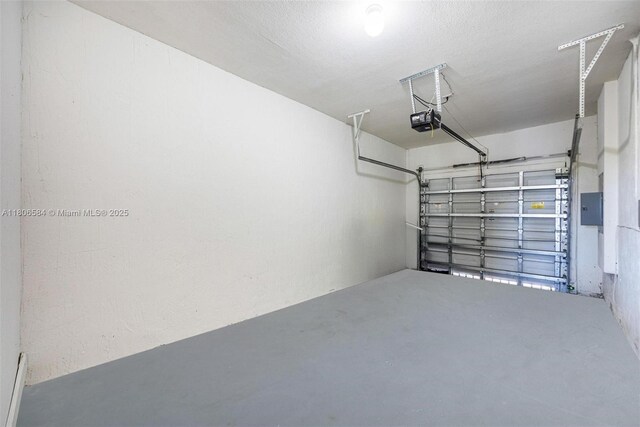 1985 SE 3rd St, Homestead, FL 33033 - garage featuring a garage door opener and electric panel