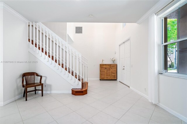 850 Nandina Dr, Weston, FL 33327 - tiled entrance foyer with baseboards, crown molding, and stairway