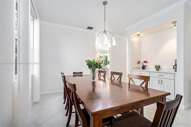 850 Nandina Dr, Weston, FL 33327 - dining room with light tile patterned floors, ornamental molding, baseboards, and a chandelier