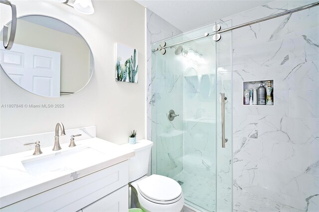 850 Nandina Dr, Weston, FL 33327 - bathroom featuring a marble finish shower, vanity, and toilet
