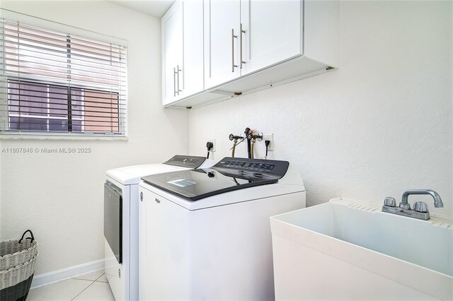 850 Nandina Dr, Weston, FL 33327 - laundry room featuring cabinet space, washer and dryer, light tile patterned flooring, and baseboards