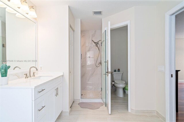 850 Nandina Dr, Weston, FL 33327 - bathroom with a marble finish shower, vanity, toilet, and baseboards