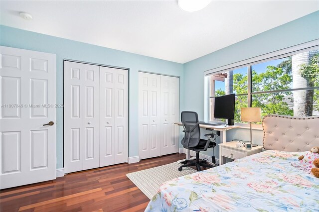 850 Nandina Dr, Weston, FL 33327 - bedroom featuring two closets, wood finished floors, and baseboards