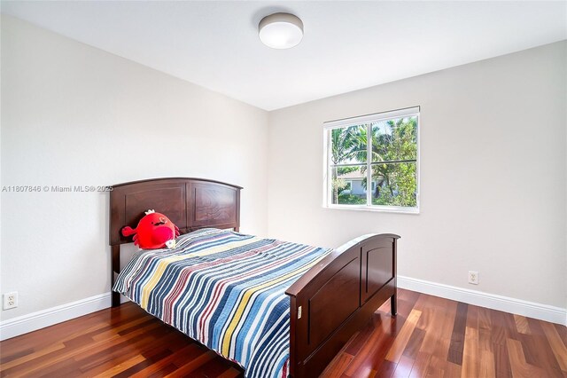 850 Nandina Dr, Weston, FL 33327 - bedroom with baseboards and wood finished floors