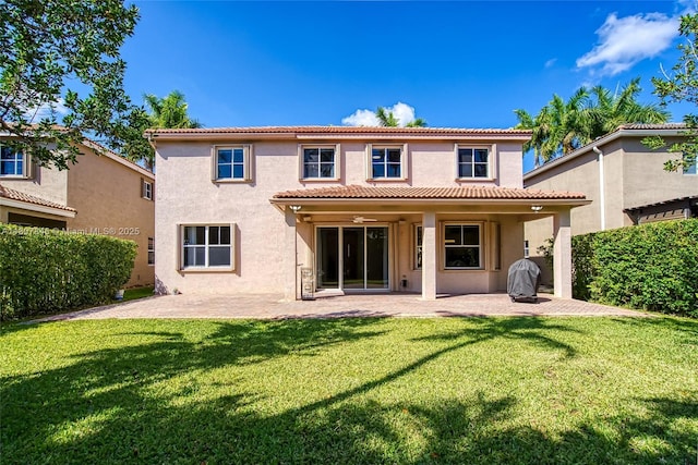 850 Nandina Dr, Weston, FL 33327 - back of property with stucco siding, a patio, and a yard