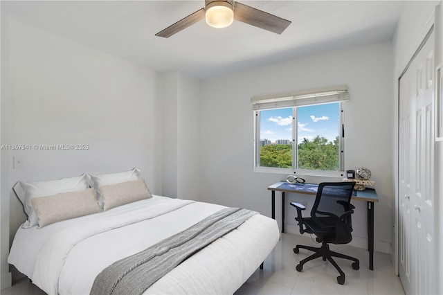 3500 Coral Way Unit 604, Miami, FL 33145 - bedroom featuring a closet, a desk, a ceiling fan, and light tile patterned flooring