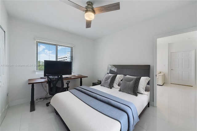 3500 Coral Way Unit 604, Miami, FL 33145 - bedroom featuring light tile patterned flooring, a ceiling fan, and baseboards