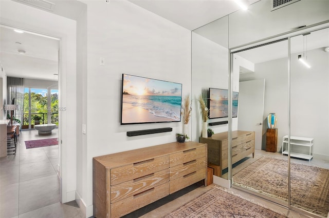 529 SW 11th St Unit 201, Miami, FL 33129 - bedroom with baseboards, a closet, and light tile patterned flooring