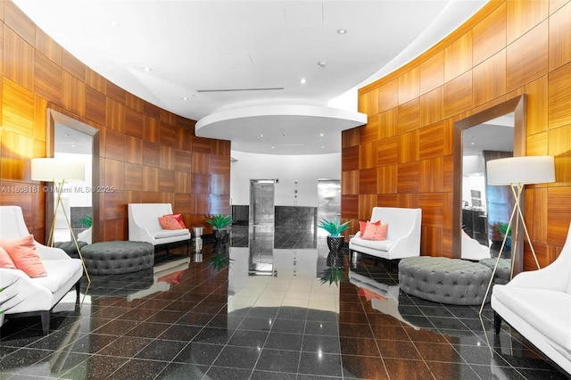 3000 Coral Way Unit 1505, Miami, FL 33145 - living room featuring granite floors and wood walls