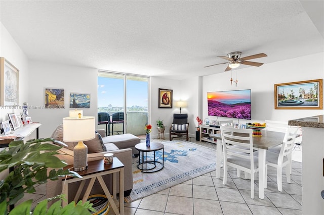 3000 Coral Way Unit 1505, Miami, FL 33145 - living area with light tile patterned floors, a textured ceiling, and a ceiling fan