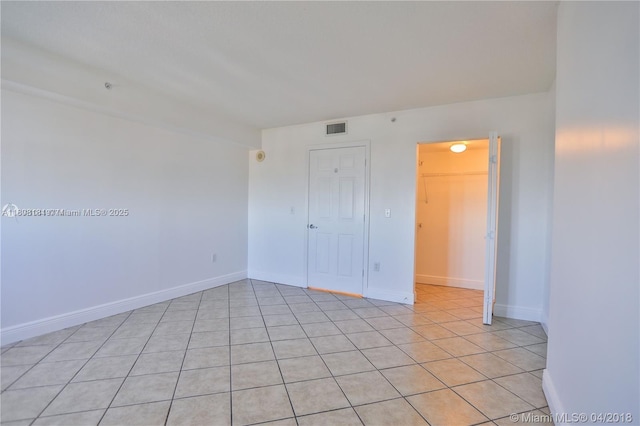 3000 Coral Way Unit 1505, Miami, FL 33145 - spare room with light tile patterned flooring and baseboards