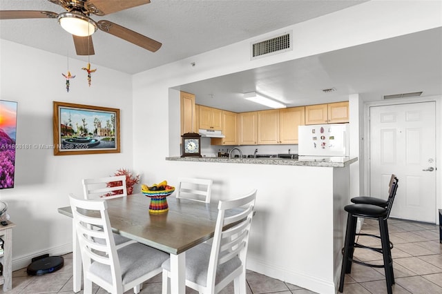 3000 Coral Way Unit 1505, Miami, FL 33145 - dining area with light tile patterned floors, ceiling fan, and baseboards