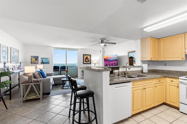 3000 Coral Way Unit 1505, Miami, FL 33145 - kitchen with a sink, white appliances, open floor plan, light tile patterned flooring, and a peninsula