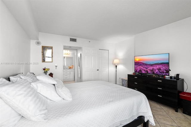 3000 Coral Way Unit 1505, Miami, FL 33145 - bedroom featuring light tile patterned flooring and ensuite bath