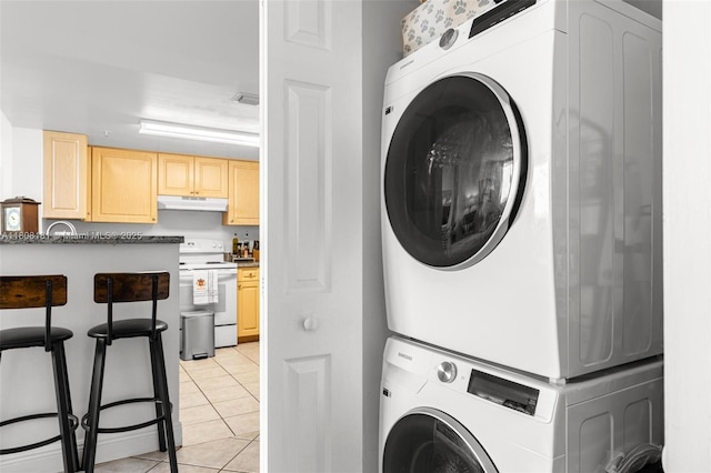 3000 Coral Way Unit 1505, Miami, FL 33145 - laundry area with estacked washer and dryer and light tile patterned flooring