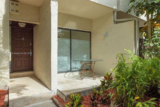 19460 NE 26th Ave Unit 12B, Miami, FL 33180 - doorway to property with stucco siding