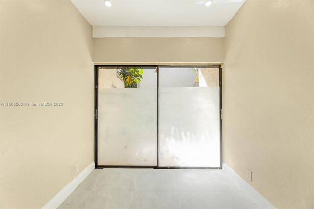 19460 NE 26th Ave Unit 12B, Miami, FL 33180 - unfurnished bedroom featuring baseboards
