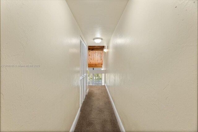 19460 NE 26th Ave Unit 12B, Miami, FL 33180 - corridor featuring baseboards and carpet