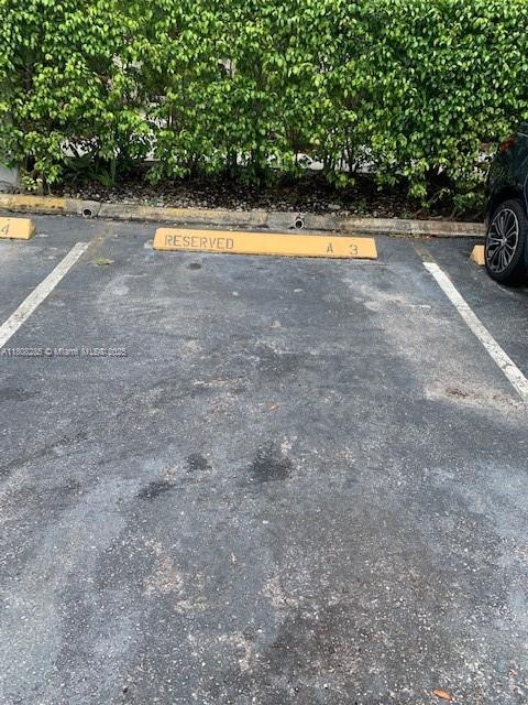 19460 NE 26th Ave Unit 12B, Miami, FL 33180 - view of uncovered parking lot