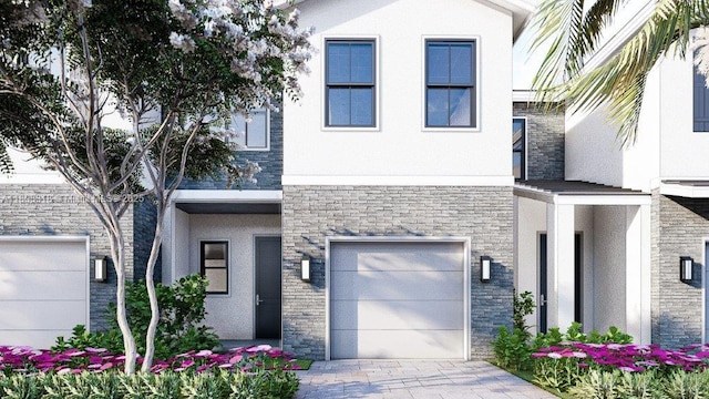 141 NE 13th Ter, Homestead, FL 33033 - view of front facade with stucco siding, stone siding, a garage, and driveway