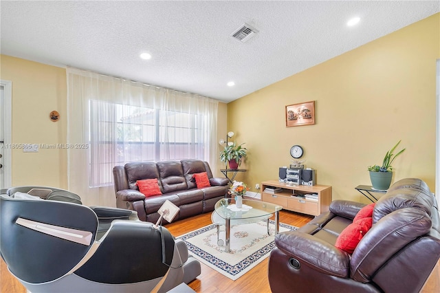 11186 NW 21st St, Coral Springs, FL 33071 - living area featuring wood finished floors, a textured ceiling, and recessed lighting