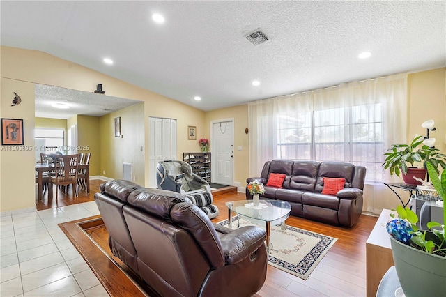 11186 NW 21st St, Coral Springs, FL 33071 - living room featuring lofted ceiling, a textured ceiling, and recessed lighting