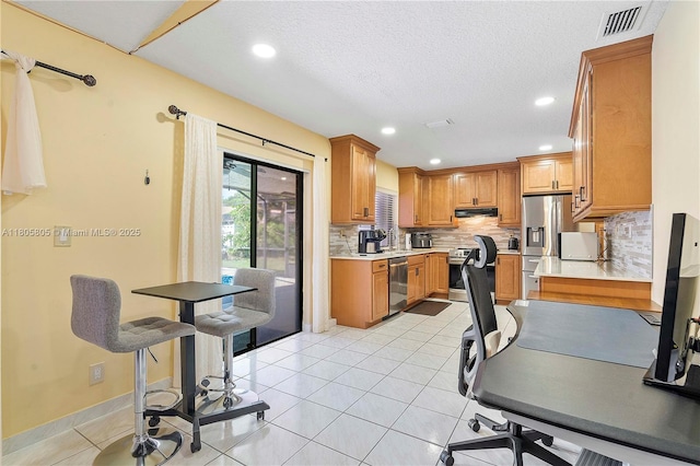 11186 NW 21st St, Coral Springs, FL 33071 - kitchen featuring stainless steel appliances, extractor fan, backsplash, light countertops, and recessed lighting