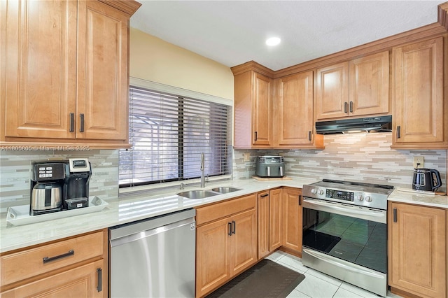11186 NW 21st St, Coral Springs, FL 33071 - kitchen with stainless steel appliances, a sink, under cabinet range hood, and light countertops