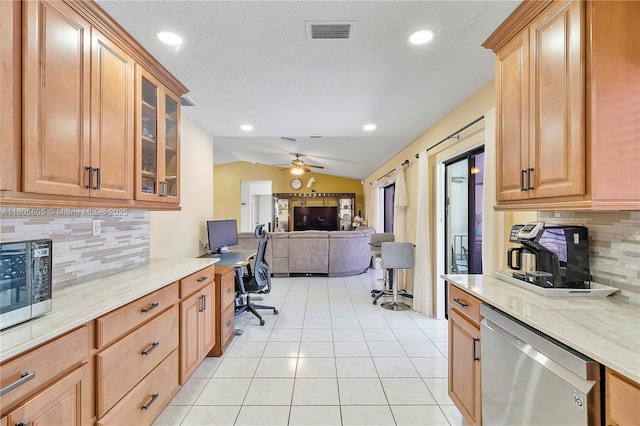 11186 NW 21st St, Coral Springs, FL 33071 - kitchen with appliances with stainless steel finishes, vaulted ceiling, backsplash, ceiling fan, and a desk