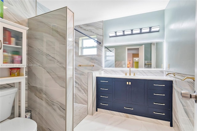 11186 NW 21st St, Coral Springs, FL 33071 - bathroom featuring tile walls, a marble finish shower, vanity, toilet, and marble look tile flooring