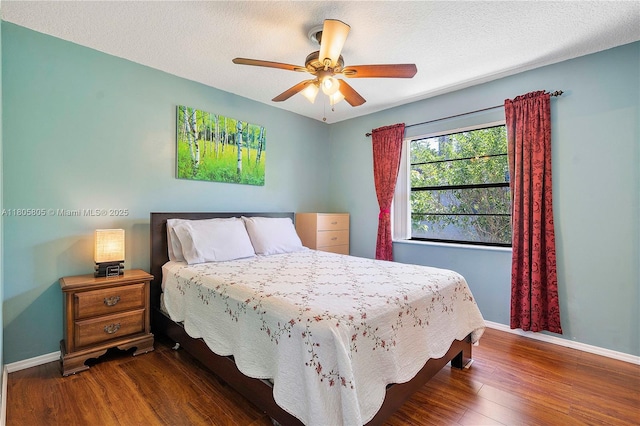11186 NW 21st St, Coral Springs, FL 33071 - bedroom featuring baseboards, wood finished floors, a ceiling fan, and a textured ceiling