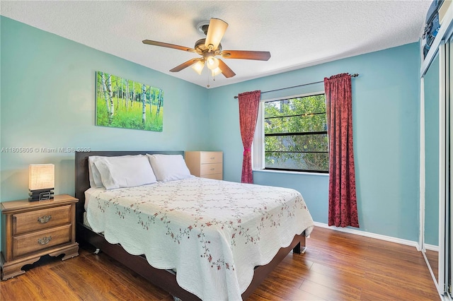 11186 NW 21st St, Coral Springs, FL 33071 - bedroom featuring wood finished floors, baseboards, a closet, ceiling fan, and a textured ceiling