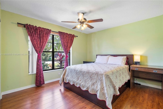 11186 NW 21st St, Coral Springs, FL 33071 - bedroom featuring wood finished floors, baseboards, a textured ceiling, and ceiling fan