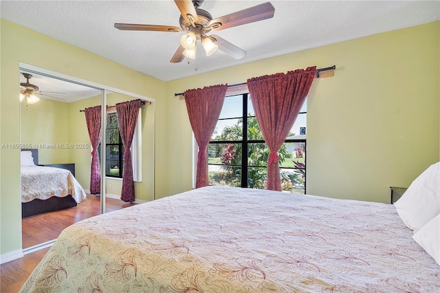 11186 NW 21st St, Coral Springs, FL 33071 - bedroom featuring wood finished floors, a closet, ceiling fan, and baseboards