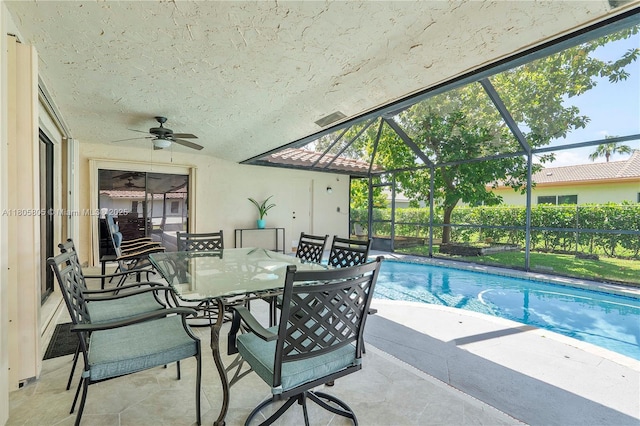 11186 NW 21st St, Coral Springs, FL 33071 - view of swimming pool featuring a patio, outdoor dining space, a ceiling fan, and a lanai