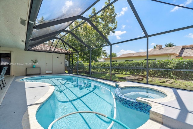 11186 NW 21st St, Coral Springs, FL 33071 - view of swimming pool featuring a pool with connected hot tub, a lanai, and a patio