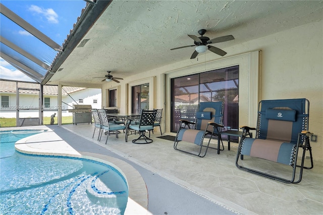 11186 NW 21st St, Coral Springs, FL 33071 - swimming pool with a ceiling fan, a patio, a grill, and glass enclosure