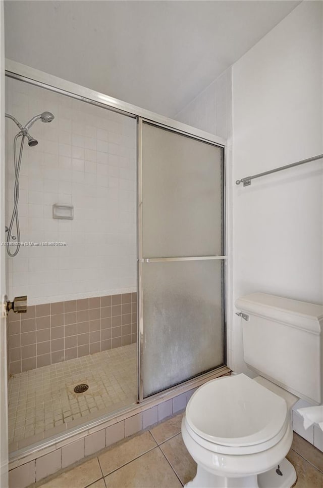 1551 NW 92nd Ave Unit 185, Pembroke Pines, FL 33024 - bathroom with a stall shower, toilet, and tile patterned floors