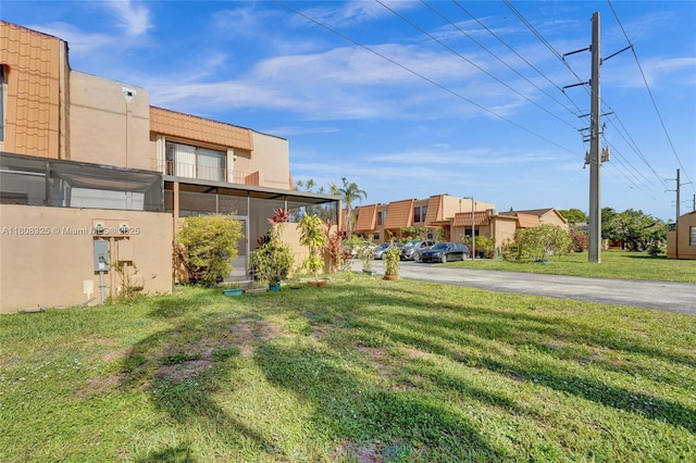 1551 NW 92nd Ave Unit 185, Pembroke Pines, FL 33024 - view of green lawn featuring driveway