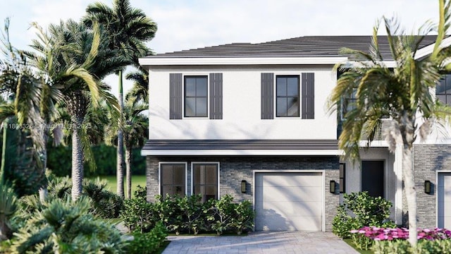 147 NE 13th Ter, Homestead, FL 33033 - view of front of property with stone siding, a garage, stucco siding, and driveway