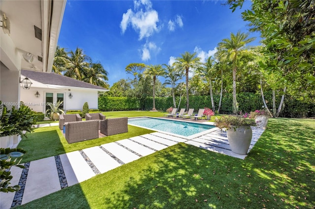 7495 SW 105th Ter, Pinecrest, FL 33156 - view of pool with french doors, a patio area, a yard, view of wooded area, and an outdoor hangout area