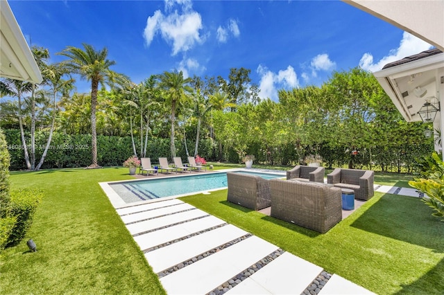 7495 SW 105th Ter, Pinecrest, FL 33156 - view of swimming pool featuring a patio, an outdoor hangout area, a yard, and view of scattered trees