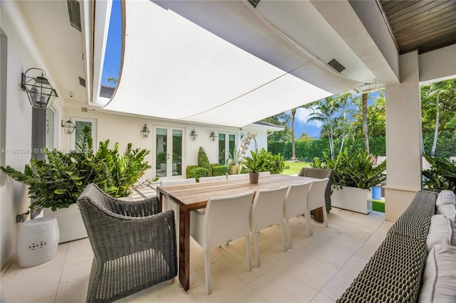 7495 SW 105th Ter, Pinecrest, FL 33156 - view of patio / terrace with french doors and outdoor dining space