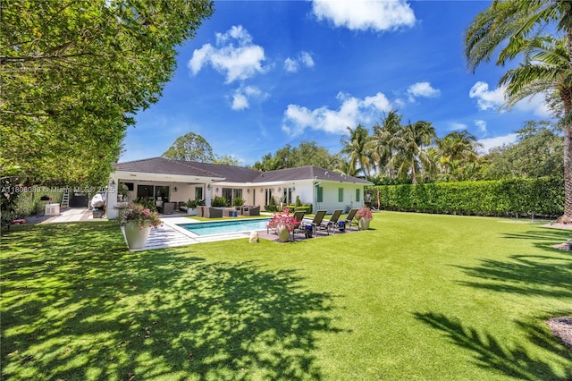 7495 SW 105th Ter, Pinecrest, FL 33156 - back of property featuring outdoor lounge area, a patio area, and stucco siding