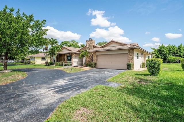 9919 SW 1st Ct, Coral Springs, FL 33071 - ranch-style home featuring stone siding, asphalt driveway, an attached garage, a chimney, and a front yard